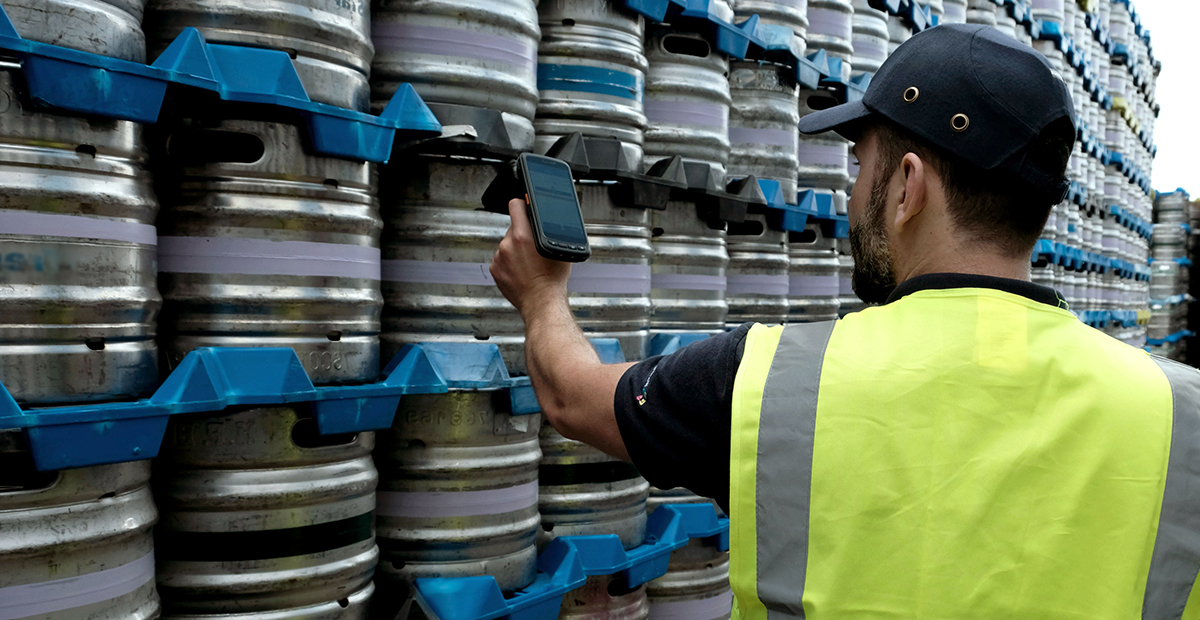 man scanning kegs