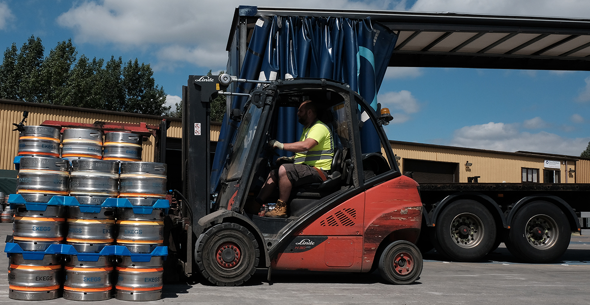 Forklift truck collecting containers